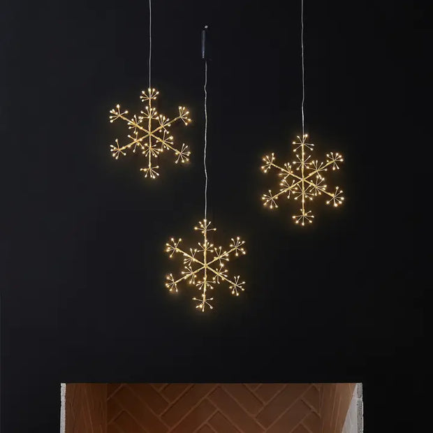 Three hanging snowflake lights 