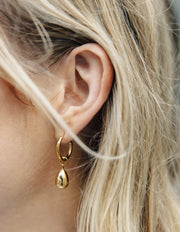 Gold Drop Hoop Earrings with a teardrop design. Nordic Muse