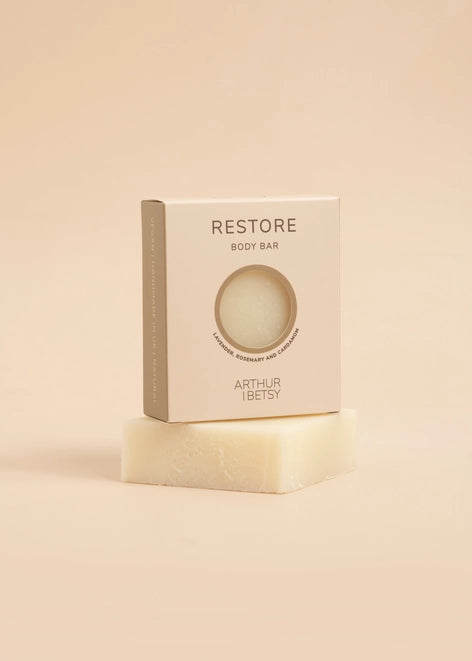 Restore Body Bar; hand-poured in Staffordshire, this 100g soap body bar is infused with a harmonious blend of lavender, rosemary, and cardamom essential oils. Arthur Betsy 