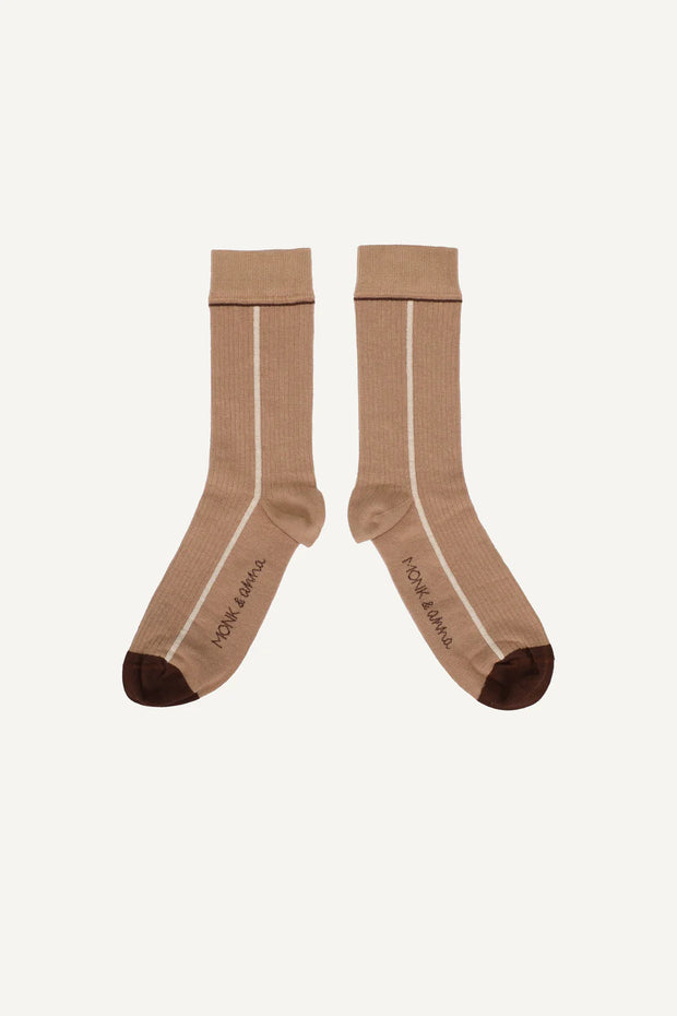 Pair of brown socks with a brand logo on a white background