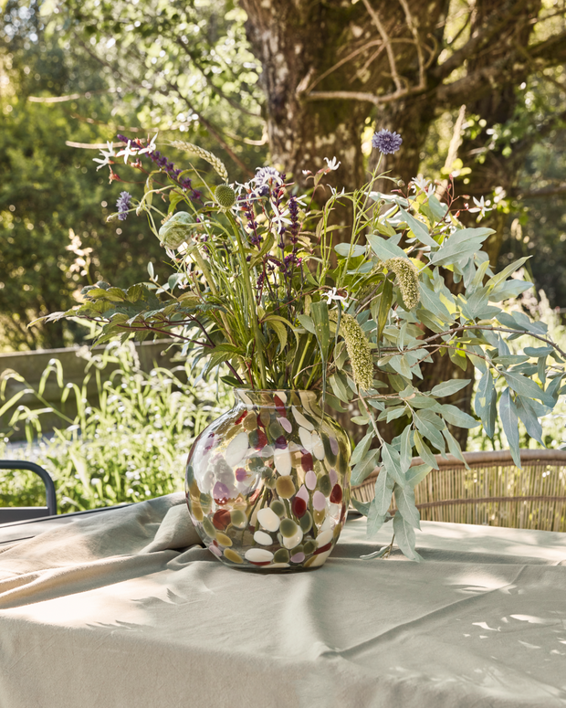 Multi colour Dot Glass Vase on table with flowers displayed