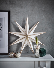 Paper 3D Stars in Champagne gold and Cream displayed on mantlepiece