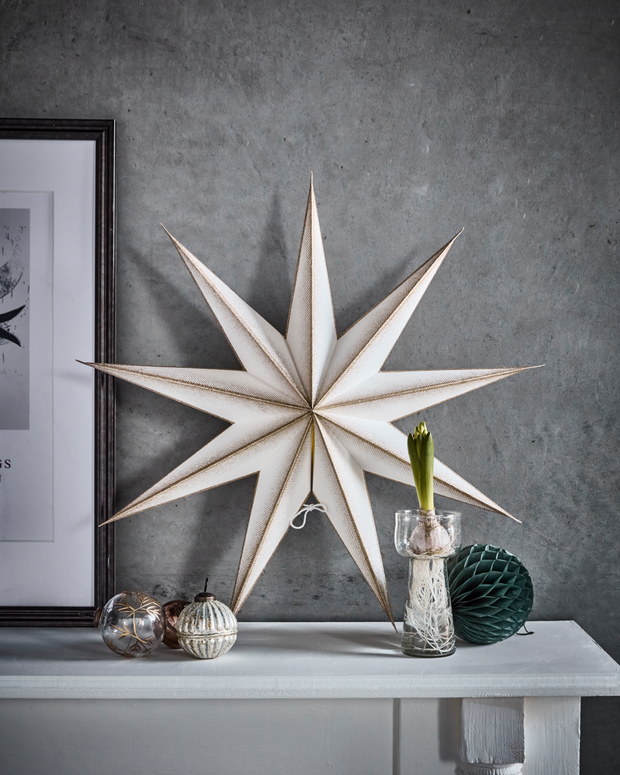 Paper 3D Stars in Champagne gold and Cream displayed on mantlepiece