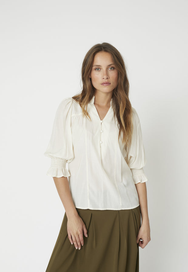 model wearing AilaCC Frill Short Sleeve V-Neck Blouse - Co'Couture