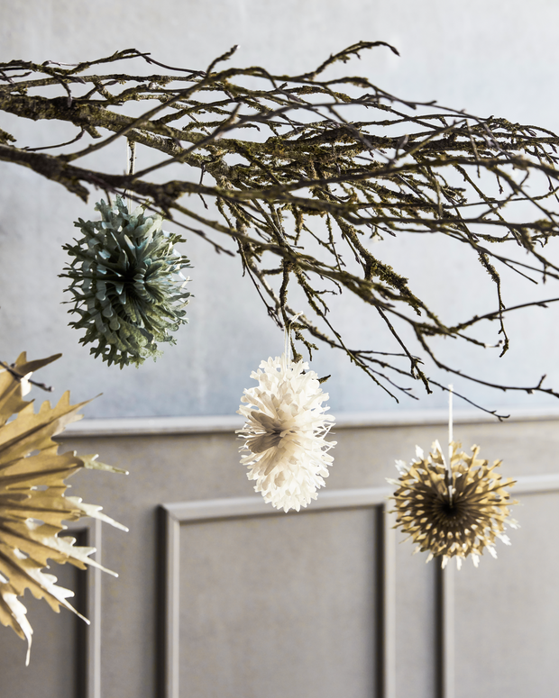 Gold Paper fans hanging on branch 