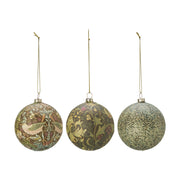 Three decorative Christmas baubles with floral patterns on a white background