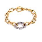 Gold and silver chain bracelet on a white background