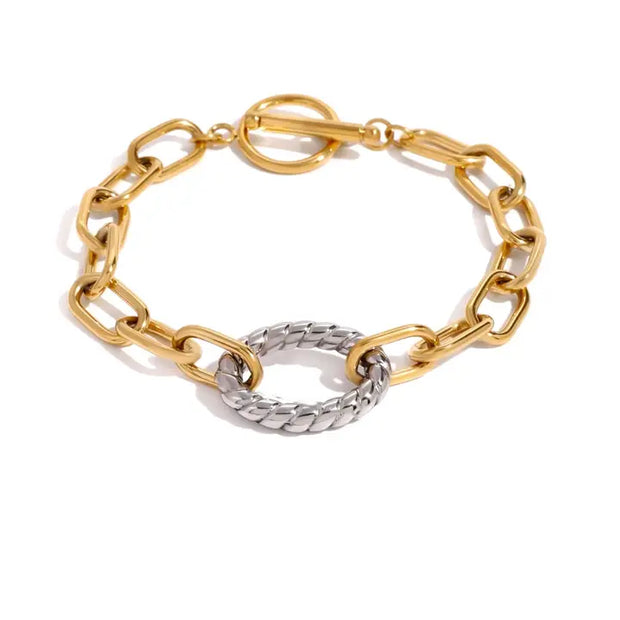 Gold and silver chain bracelet on a white background