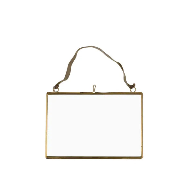 Gold-framed mirror with a strap on a white background
