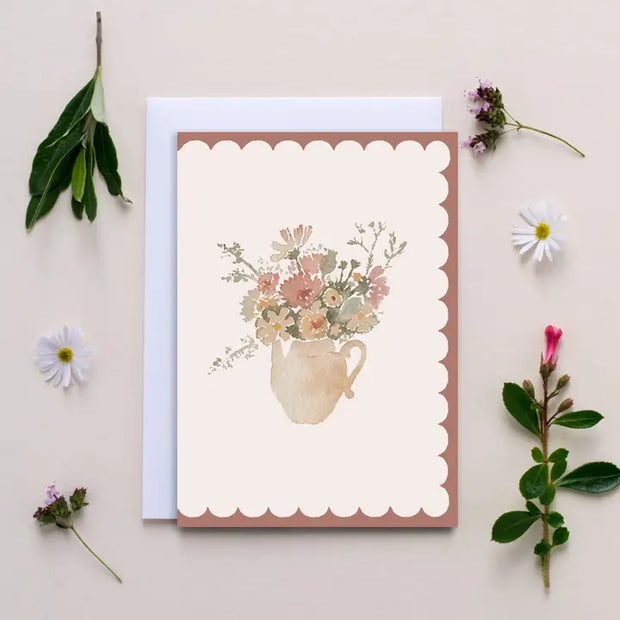 Greeting card with floral design on a beige background