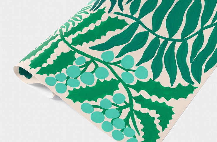 Single sheet of gift wrap in christmas greenery pattern