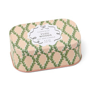 Candle tin with green leaf pattern and 'Paddywax Yuzu Woods' label on a white background