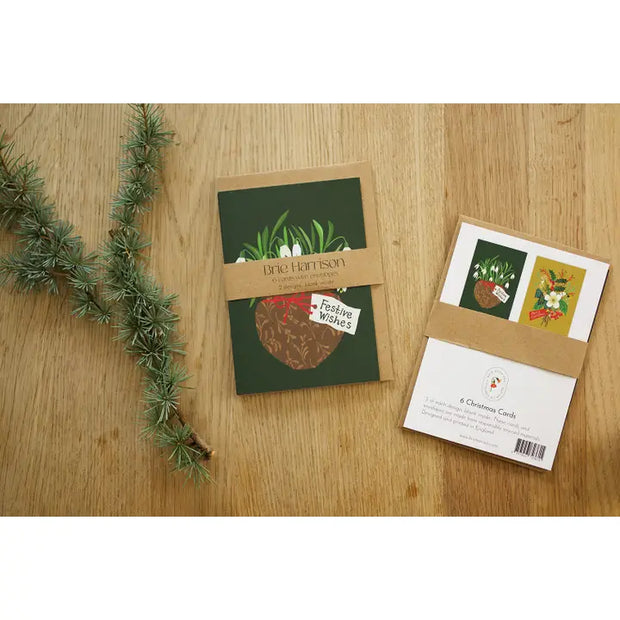 Set of Christmas cards with decorative elements on a wooden surface