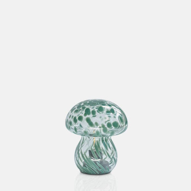 Glass mushroom LED lamp with green speckled pattern on a white background