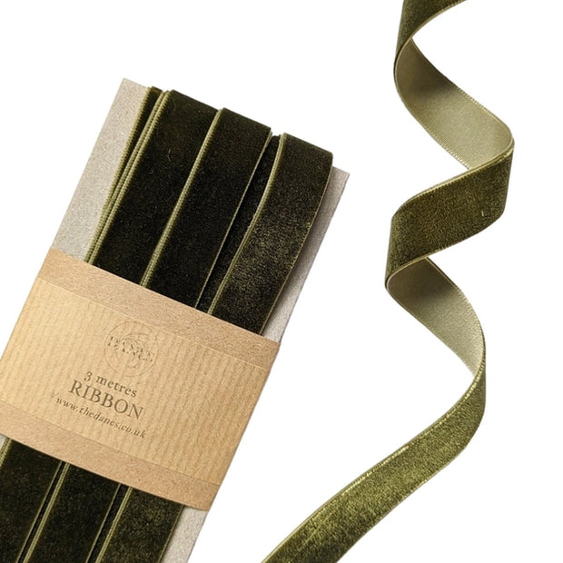 Packaged green ribbon with a label on a white background