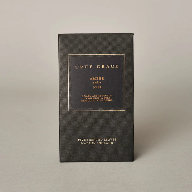 Black box with gold text on a beige background