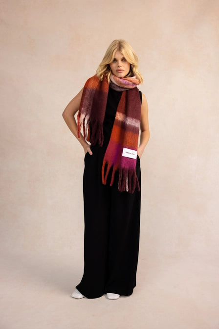 model wearing Stockholm Autumnal Falls Scarf - red & purple check design