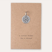 A little flower for a friend charm on brown card. Kutuu