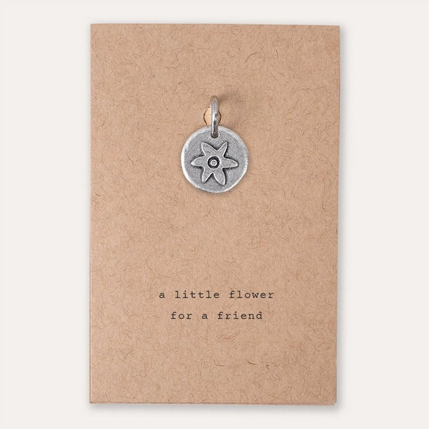 A little flower for a friend charm on brown card. Kutuu