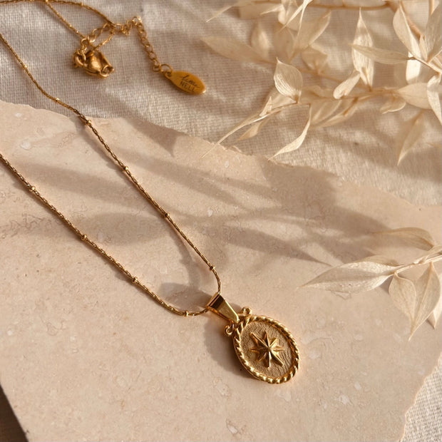 Gold oval star pendant necklace