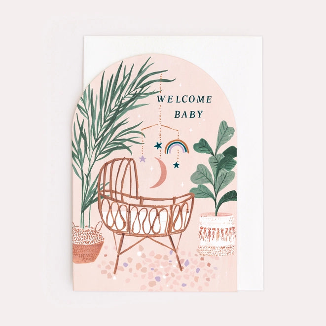 Gender-neutral, unisex new baby card with illustrated bamboo crib and mobile. Stylish arch shape new baby card with a luxury white envelope.