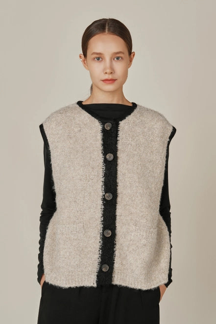 Grade and Gather winter sweater vest in oat and black.