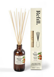 Aromatherapy diffuser bottle with sticks and packaging on a white background