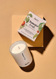 Aery Tomato Leaf candle and packaging on a beige background