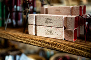Boxes of Fudge Kitchen fudge on a wooden shelf with a blurred background - from Victoria Shop