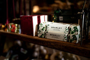 Bramley Bubble Bath Christmas Cracker on wooden bench - from Victoria Shop