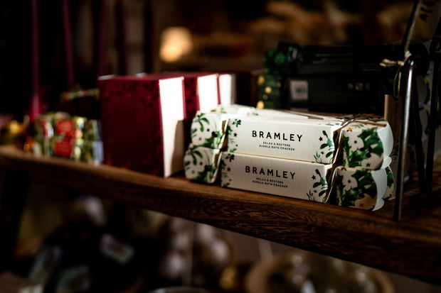 Bramley Bubble Bath Christmas Cracker on wooden bench - from Victoria Shop