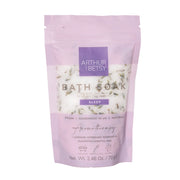 Purple package of Arthur & Betsy Bath Soak with white text and product details on a white background