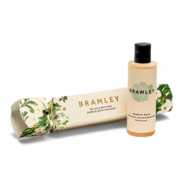 Bramley bubble bath Christmas cracker and bottle on a white background