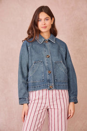 model wearing short denim jacket 