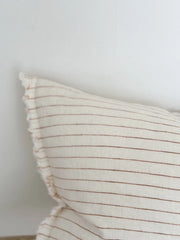 detail  of the Pinstripe Rust Linen Cushion 50x30 - Esmee