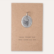 Kutuu charm- "Never forget how very loved you are". 