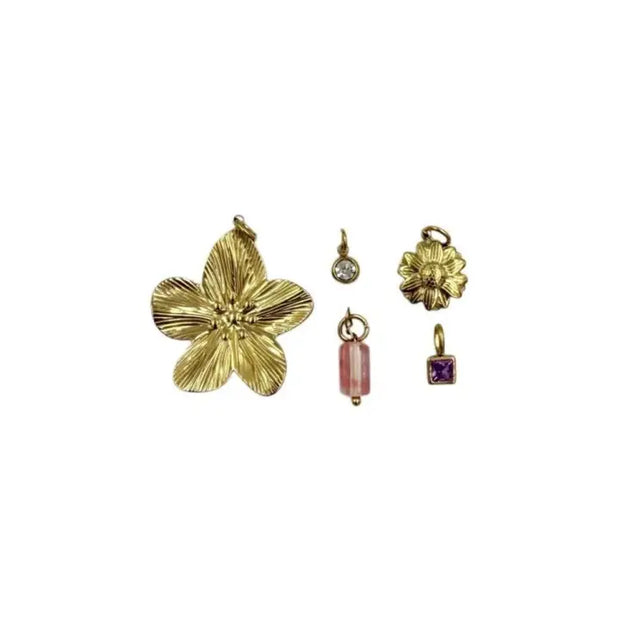 Set of gold and other colored pendants on a white background