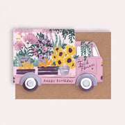 Deliver some beautiful birthday blooms with this flower truck birthday card, perfect for a gardener or sending flowers in the post! This unique shaped greeting card is illustrated with sunflowers, peonies and lush foliage and the caption “happy birthday”.
