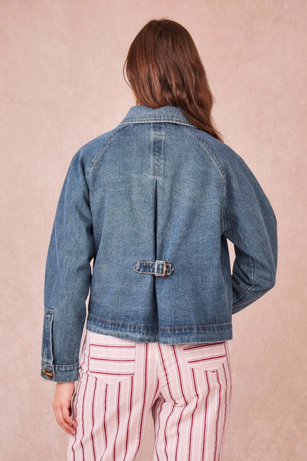 reverse detail of buckle on the back of the denim jacket