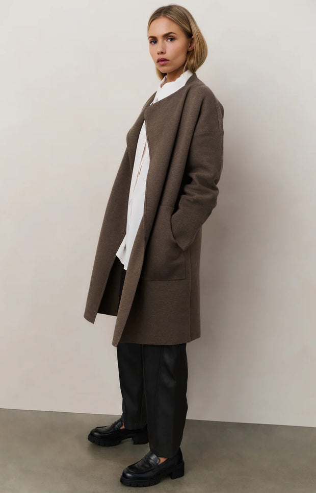 model wearing faux leather trousers from yaya
