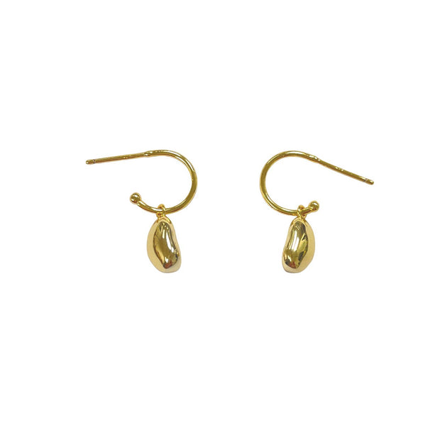 Gold teardrop earrings on a white background