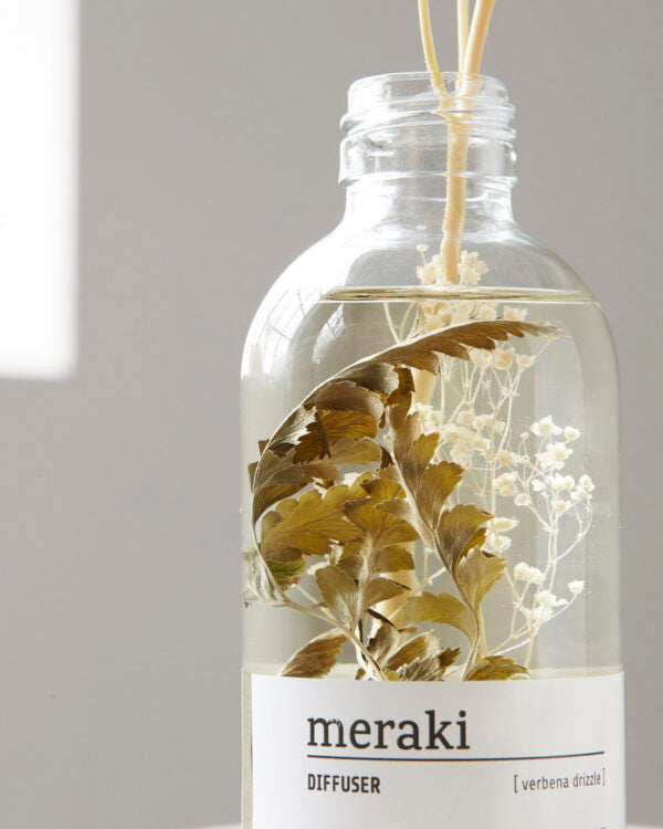 Meraki Verbena Drizzle Reed Diffuser detail of flowers in bottle 