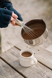 harth hot chocolate being poured from a pan