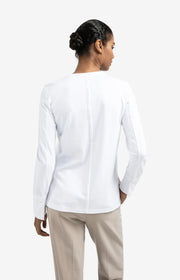 back detail of slit in white jersey top