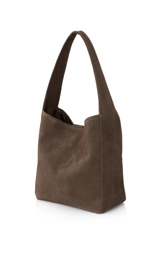 Brown leather handbag on a white background