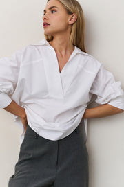model wearing Poplin blouse with polo collar and V-neck