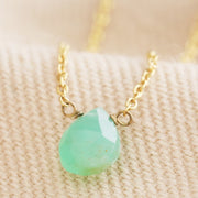 This necklace is comprised of a single chrysoprase crystal stone in a teardrop shape suspended from a delicate gold chain.