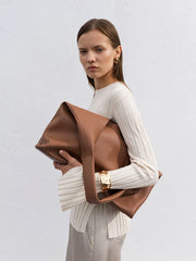 model with Slouchy Brown Vegan Leather Bag