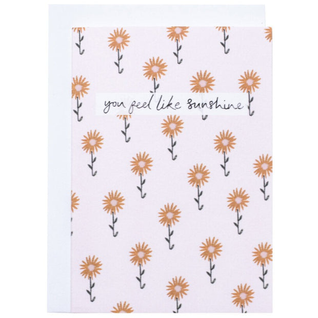 Light pink card with small sunflowers. You Feel Like Sunshine Text