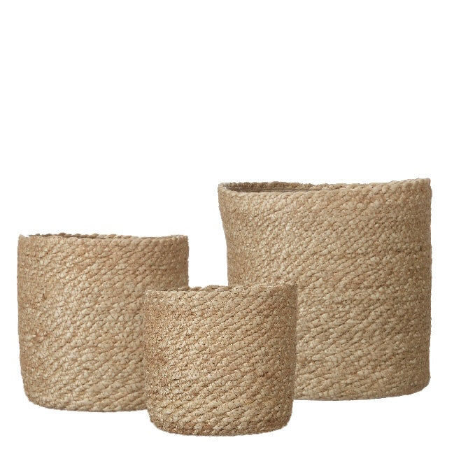 woven seagrass pots on a white background. pots have a waterproof plastic lining.
